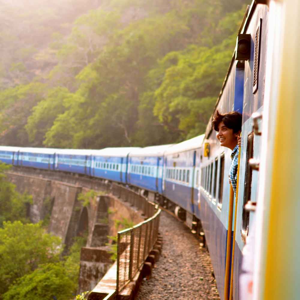 Woman looking out window of train